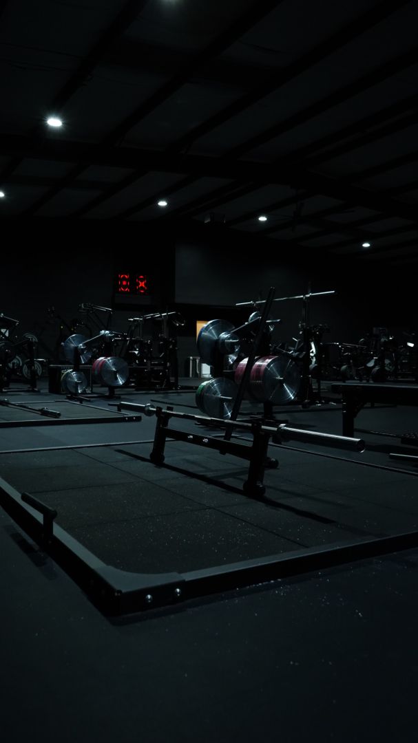 Lifting platforms with loaded barbells on the powerlifting floor