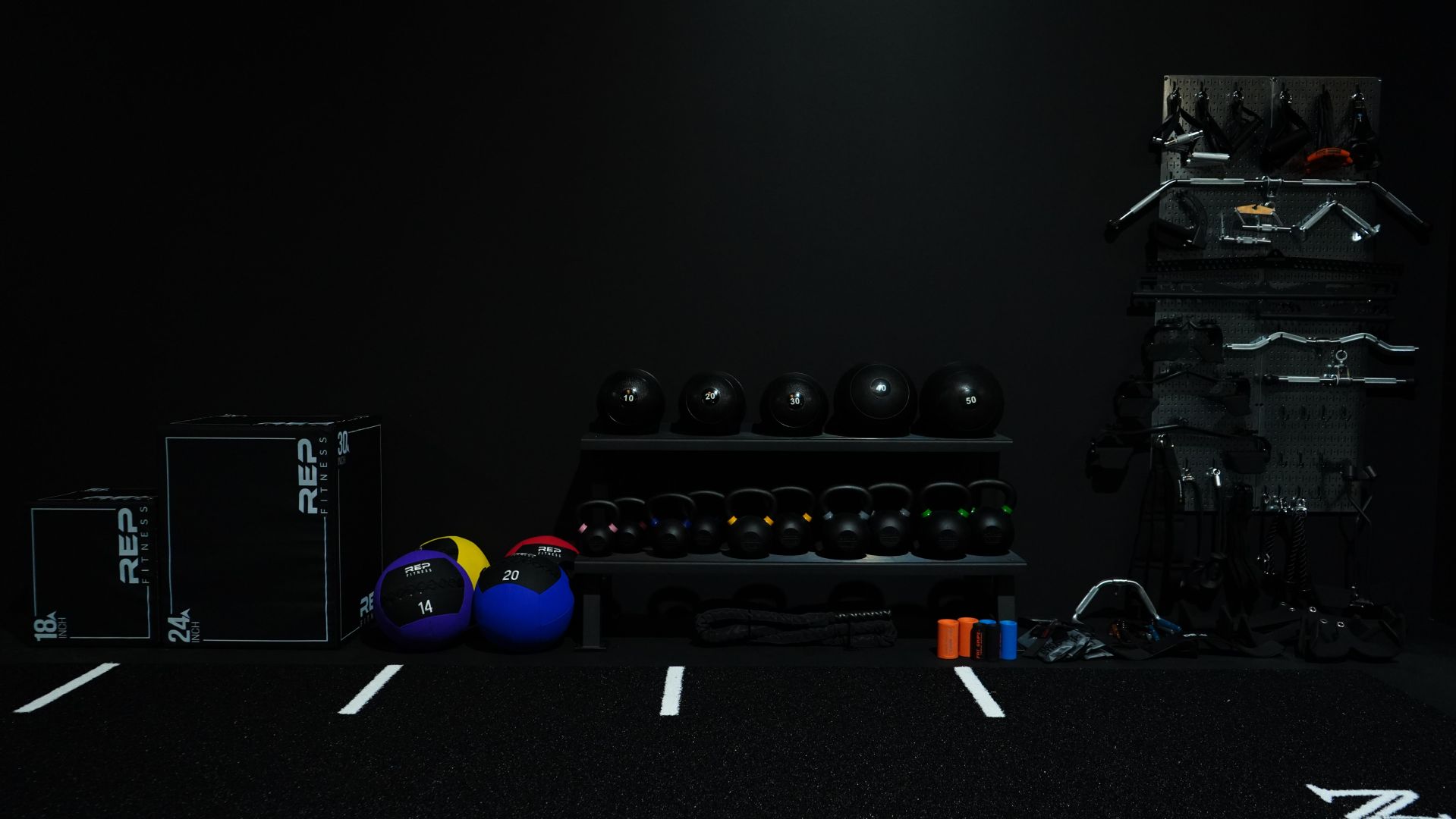 Turf zone with plyo boxes, kettlebells and sleds
