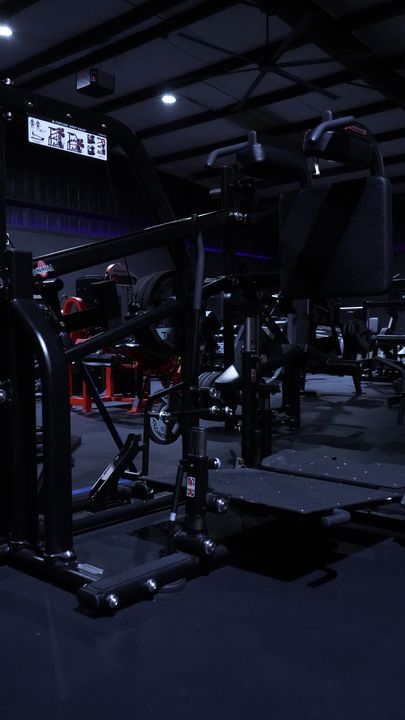 Plate loaded leverage machine beside the rack area