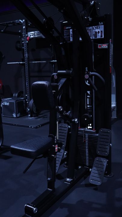 Selectorized cable station with weight stacks near the rack