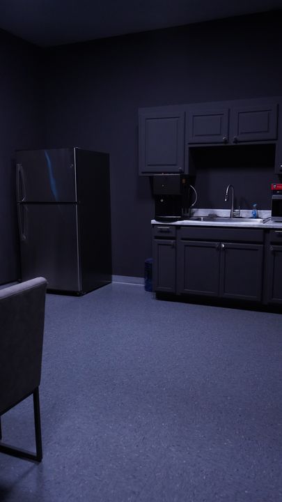 Kitchen with refrigerator, sink and cabinets