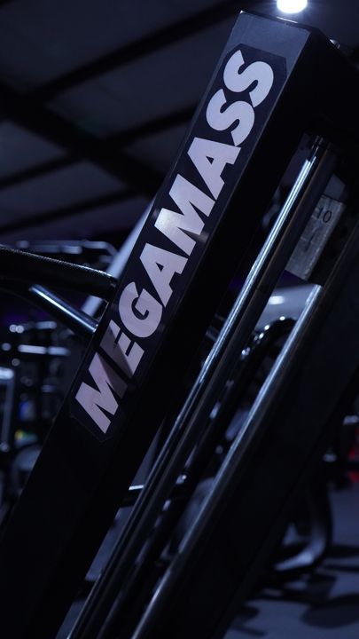 MEGAMASS lettering on a black machine arm